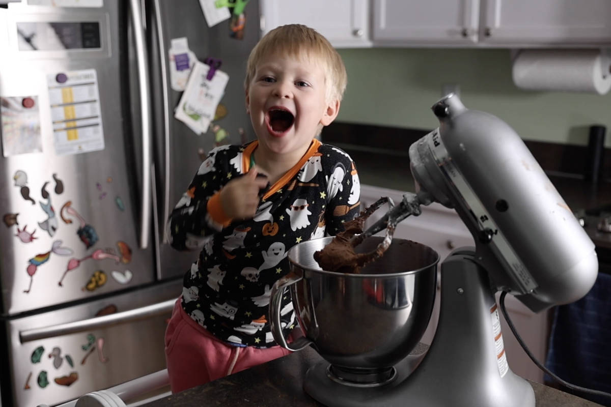 Mixing chocolate butter cream in a stand mixer.