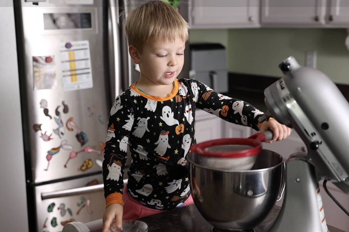 Sifting dry ingredients into mixing bowl.