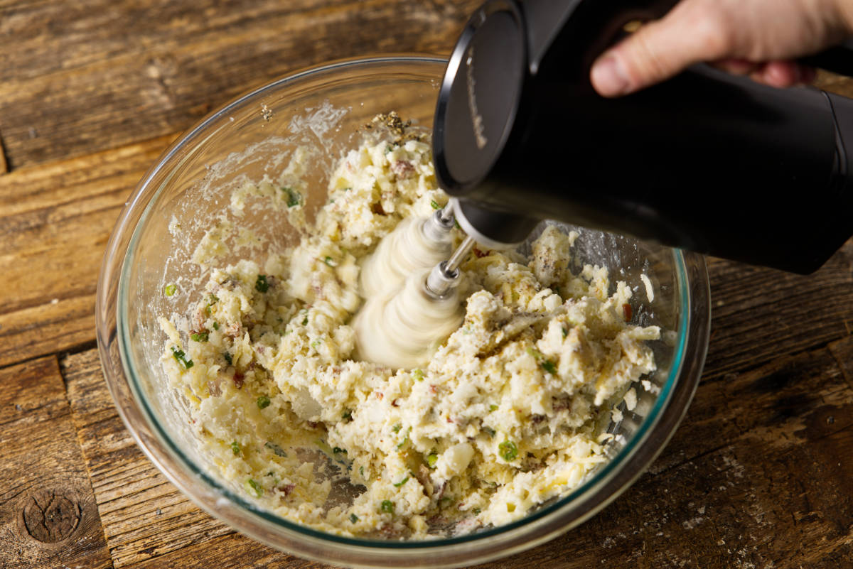 Mixing the filling for twice baked potatoes.