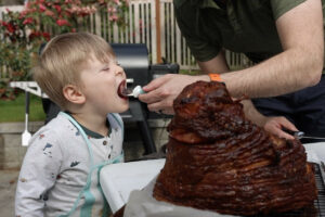 Taking a bite of double smoked ham.