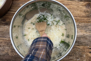 Mixing bread crumb topping in a large mixing bowl.