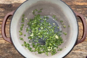 Diced jalapeño peppers in dutch oven.
