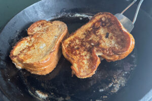 Flipping stuffed French toast.