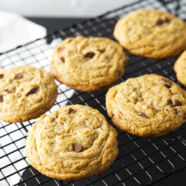 Cookies lined up on a wire rack to cool.