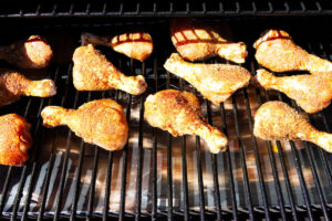 Cooking chicken legs on a pellet grill.