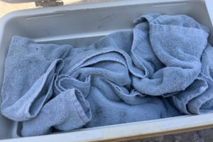 Brisket wrapped in blanket and resting in cooler.