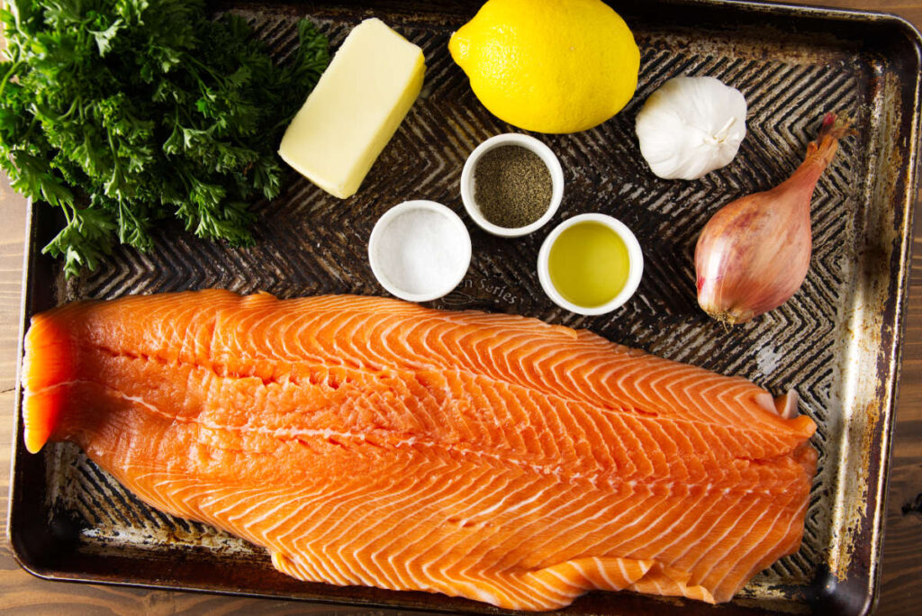 Ingredients for pellet grill salmon laid out on a baking sheet pan.