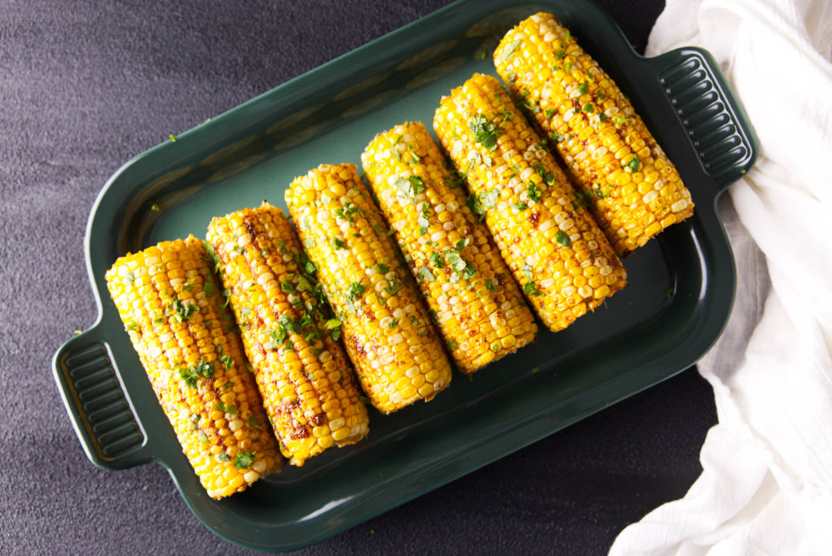 Platter of smoked corn on the cob ready to serve.
