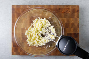Creaming butter and sugar in a mixing bowl.