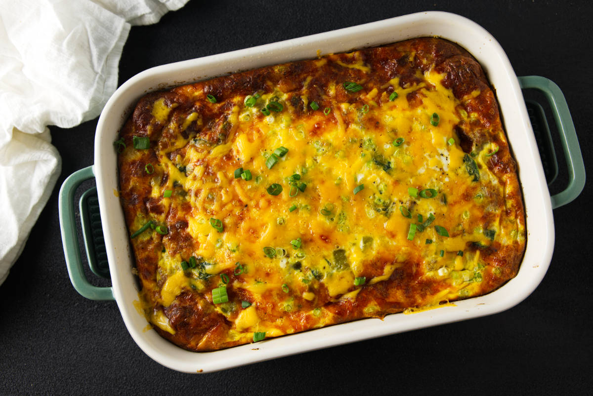 Full pan of cheesy crescent roll breakfast casserole viewed from above.