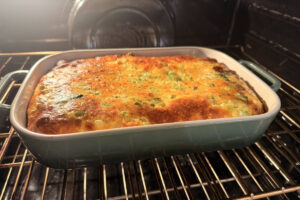 Breakfast casserole in a baking dish inside the oven.